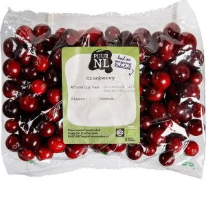 organic cranberries in packet on white background